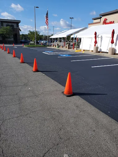 Traffic cones protecting a freshly striped shopping center parking lot in Alabama